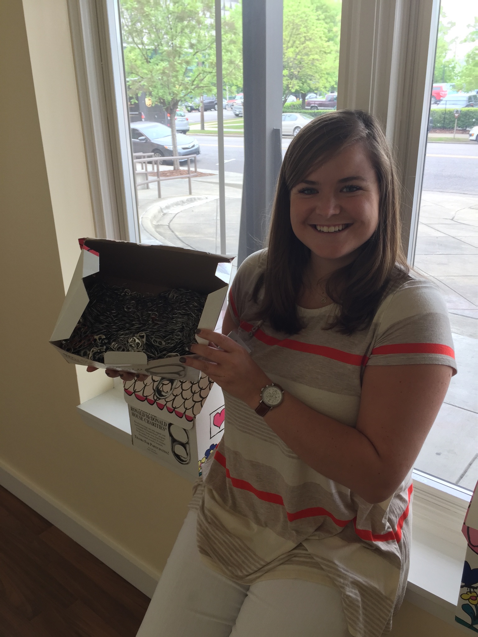 Mallie shows off collected pop tabs