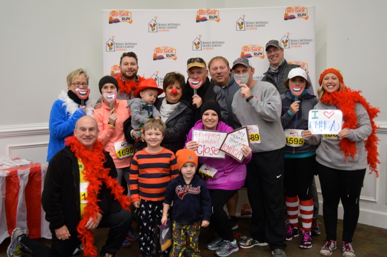 Runners pose at the Red Shoe Run