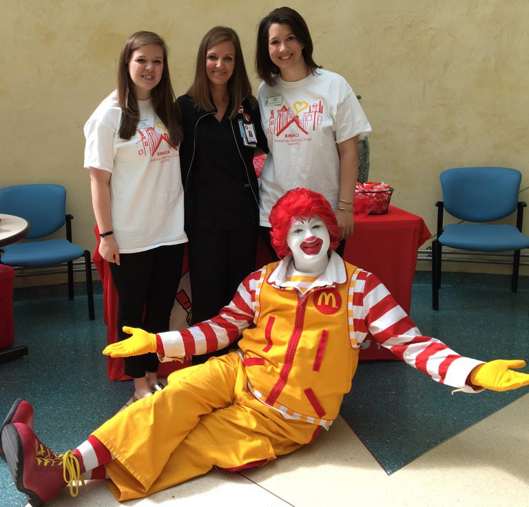 Ronald McDonald with a Children's of Alabama nurse and RMHCA staff