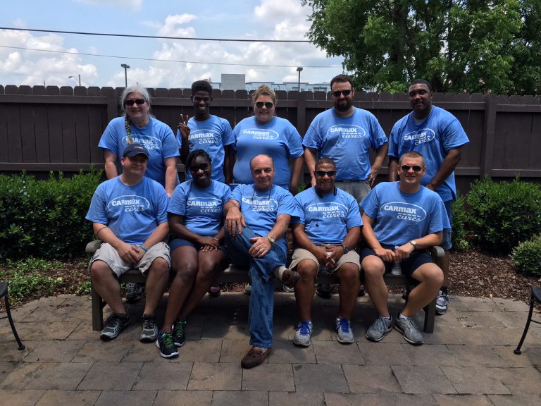 Volunteers from Carmax help out at the House