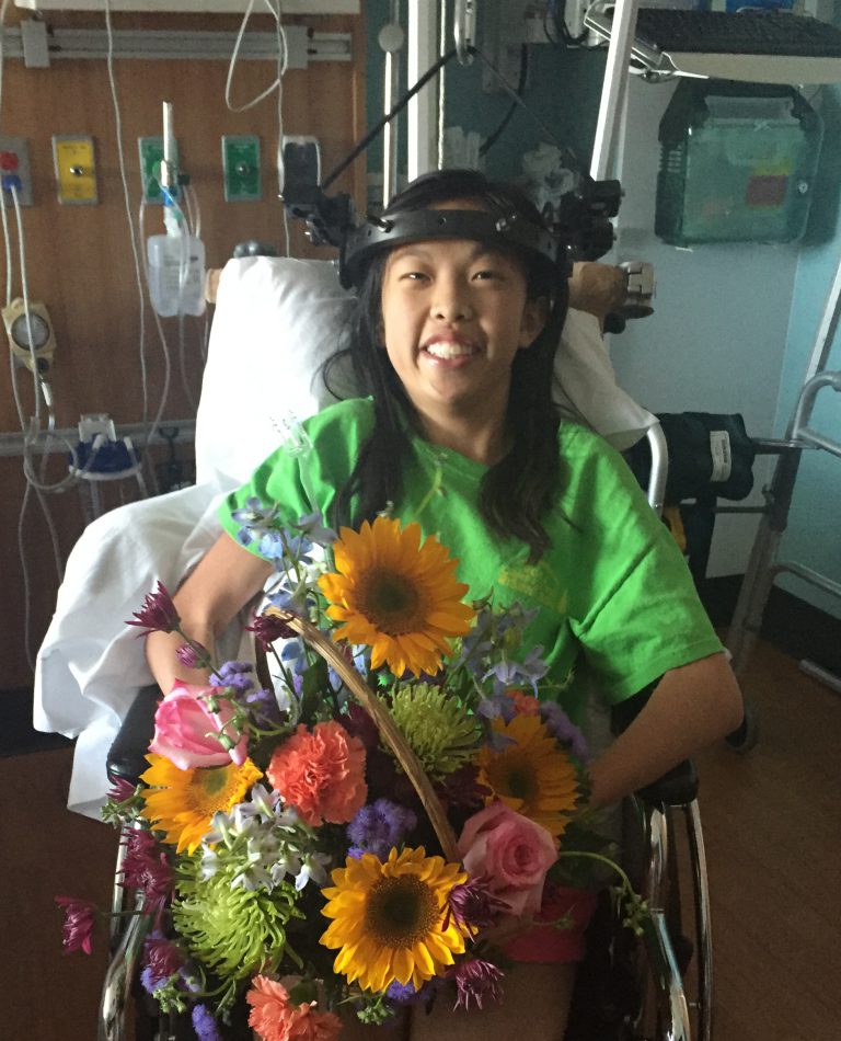 Kate, one of our RHMCA kids, smiles big for the camera.