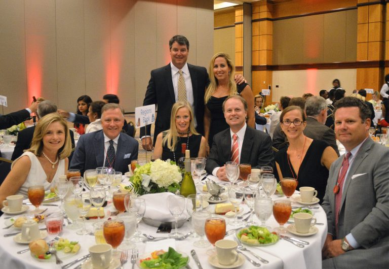 Friends pose at the Heart of the House gala