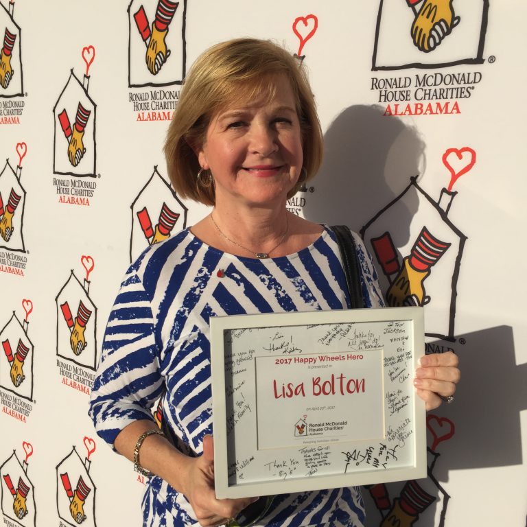 Lisa accepts her award for Happy Wheels Hero