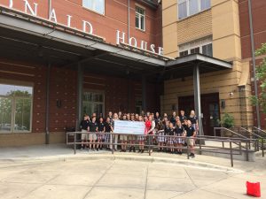 Prince of Peace students pose with their check outside of RMHCA