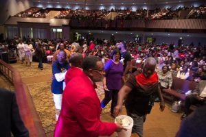 Attendees donate money to RMHCA. This love offering is taken up in each city of the gospel tour. Photo: Ven Sherrod