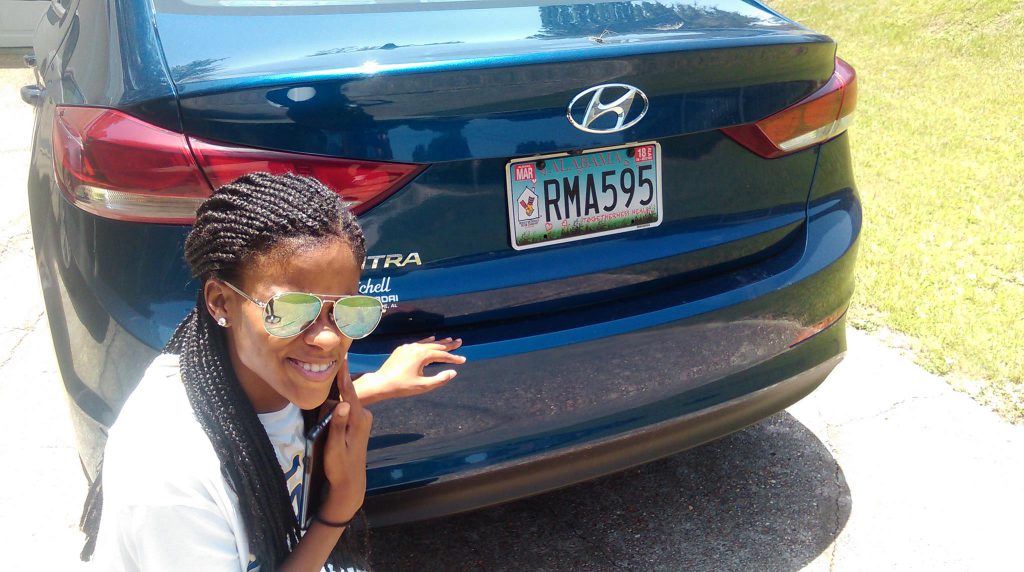 A former guest family shows off their RMHCA specialty car tag. Source: Victor Clements