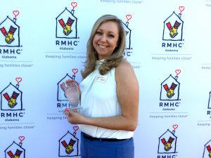 Aaron Fobian poses with her volunteer award.