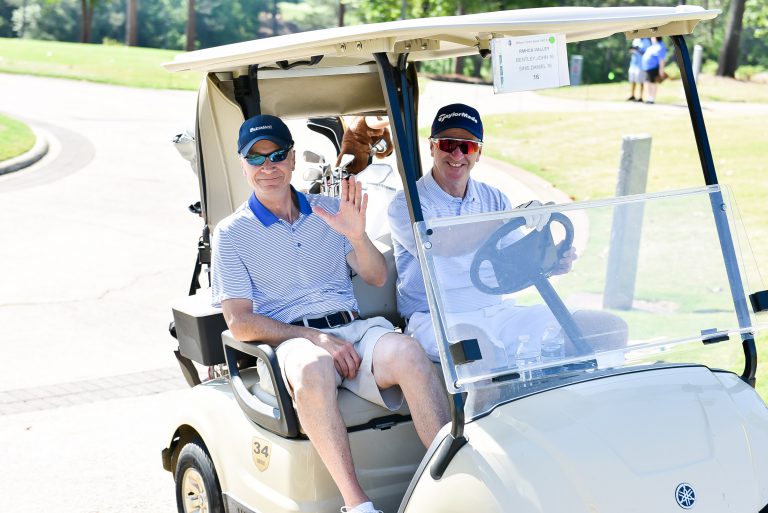 Golfers peel off to their course.