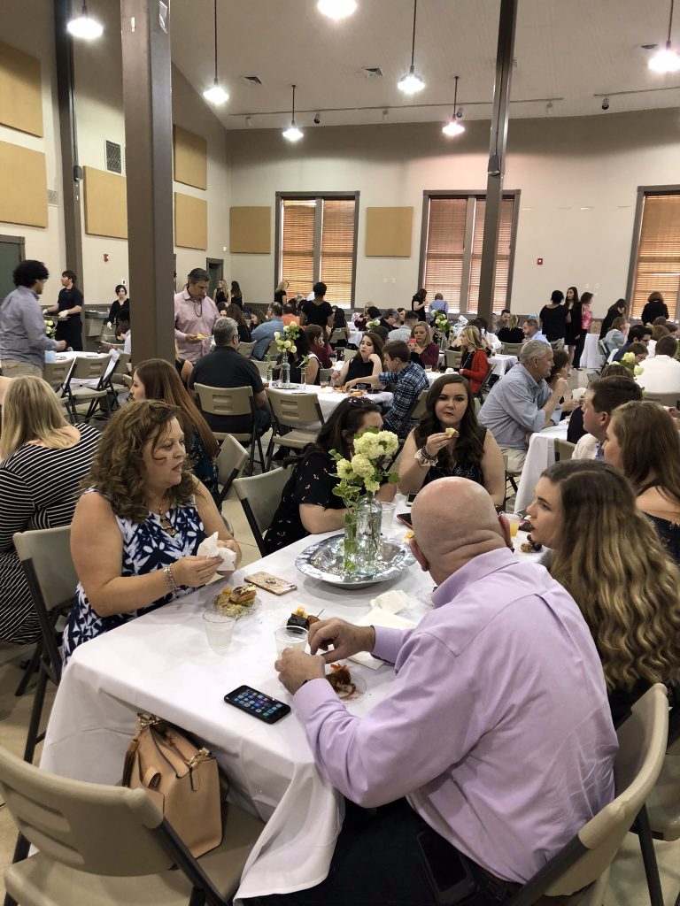 A Night for Ronald attendees enjoy dinner and live music.