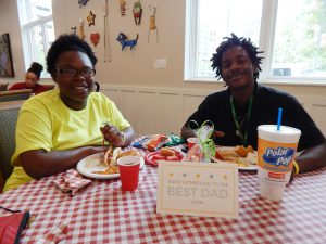 L-R: Commish and Demarius enjoy dinner together after visiting D'Niah.