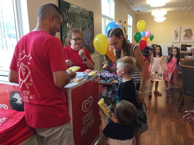 A family picks out some ice cream treats.