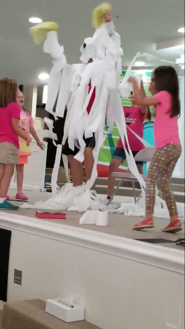 Mt. Zion Baptist Church Vacation Bible School kids toilet paper their youth minister after winning a contest to raise the most money for RMHCA