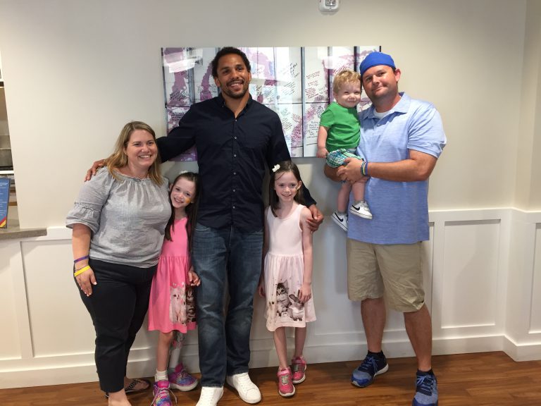 The Horne family with former Tide player Eryk Anders.