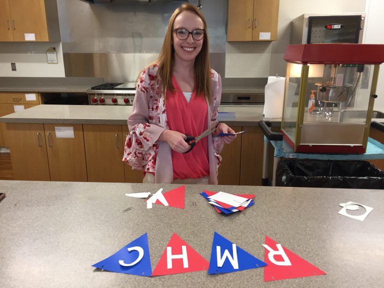 Kathryn Coaker helps prepare for a community event.