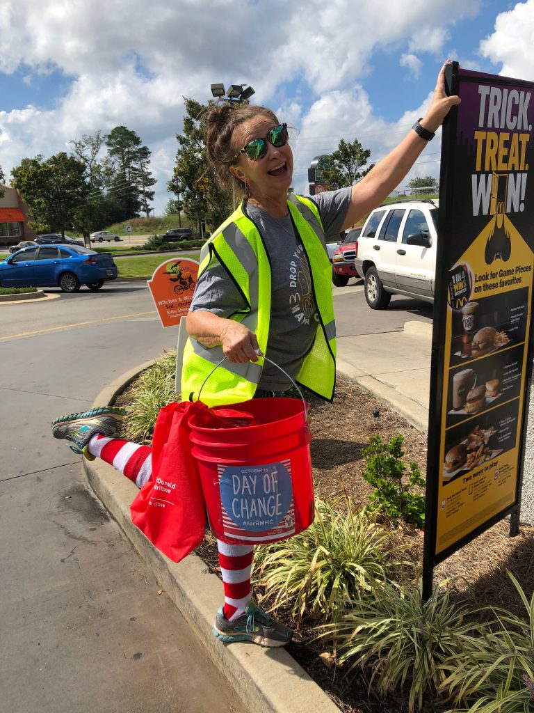Supporter Debbie collects change in McCalla on Day of Change.