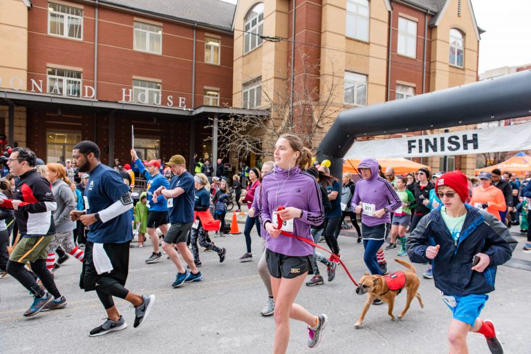 Red Shoe Run 5K runners take off