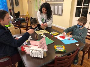 Leigh Anne Terch hosts Art Cart for two children and some parents.