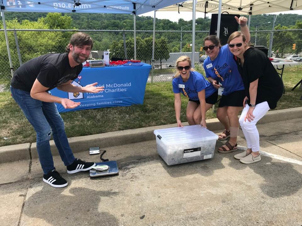 People weighing pop tabs