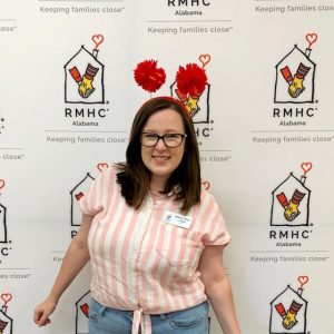 Zelma Mae in front of RMHCA-branded background at the RMHCA 40th Birthday Party
