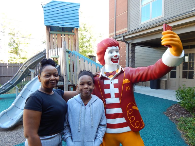 Ivokisha and Javaras Grayson pose for a photo on the playground.