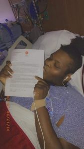 Za'Kelby kisses the letter confirming his place on the heart transplant list.