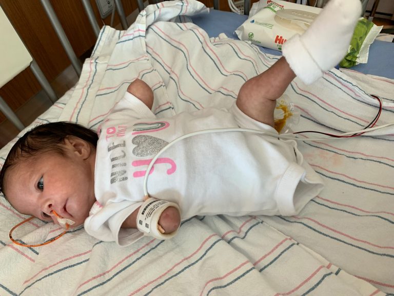 Baby in a hospital bed