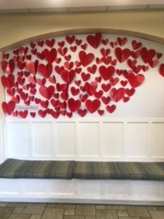 With Love wall decorated with paper hearts