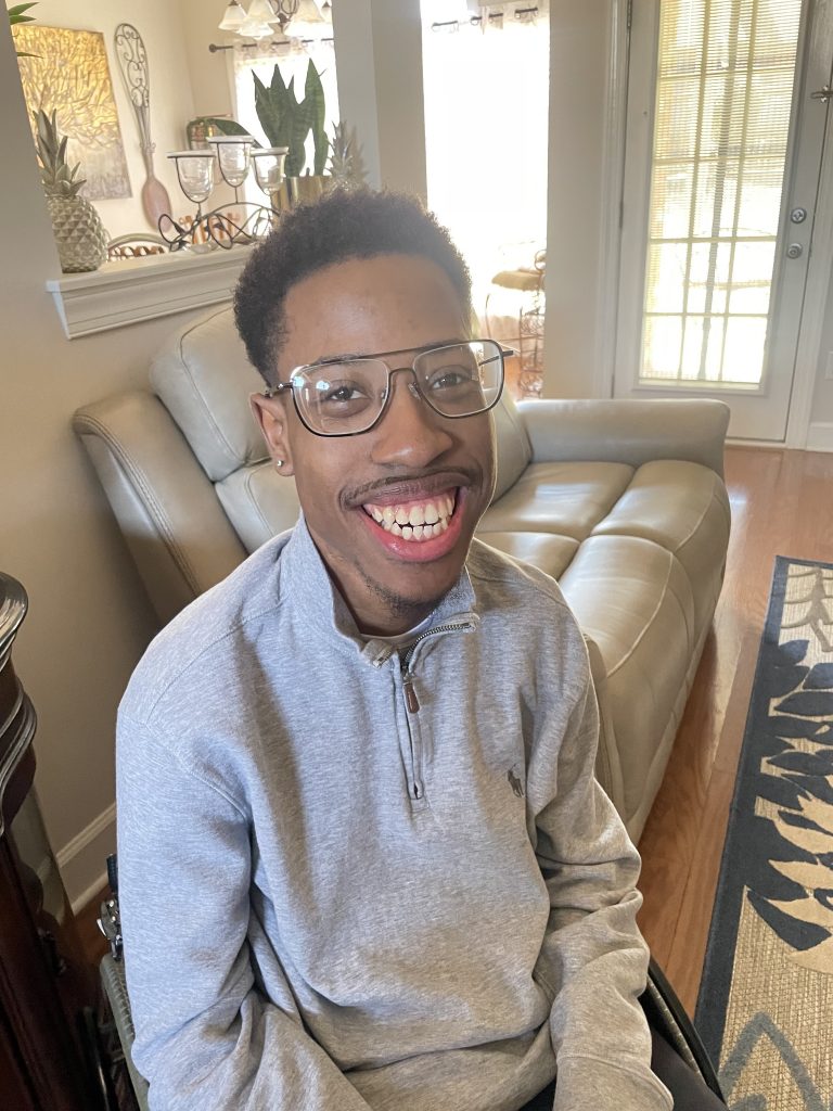 A man smiles for the camera
