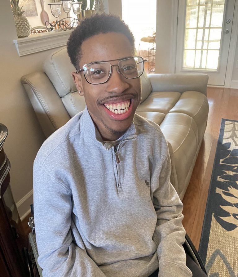 A man smiles for the camera
