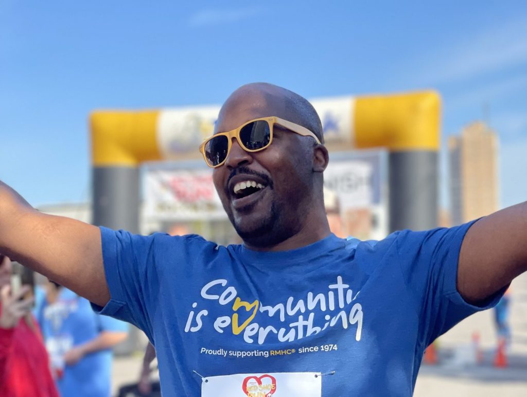 Community is everything shirt on a person at an event