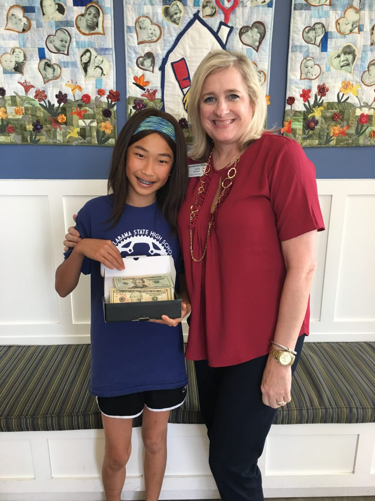 An-Mei donates money to RMHCA