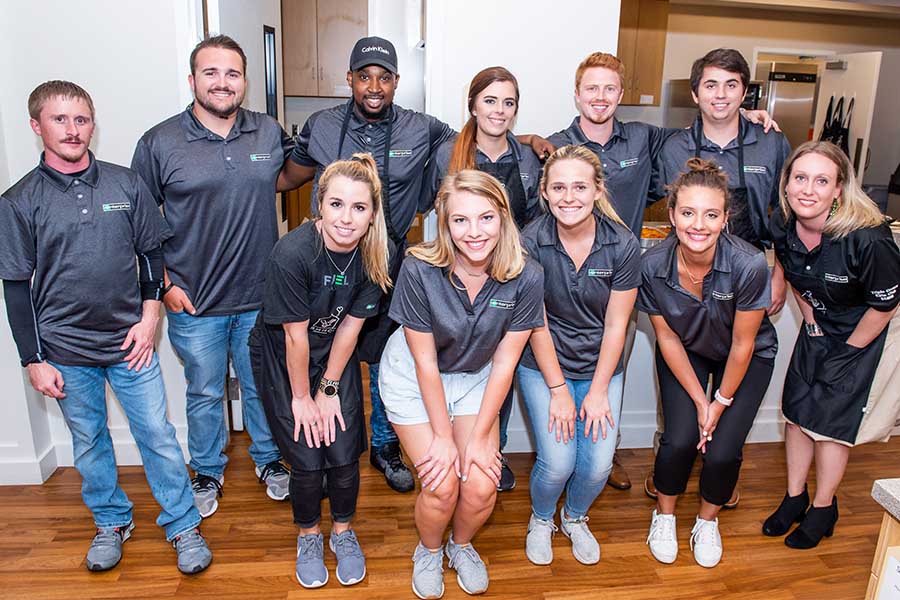 volunteers pose for a photo