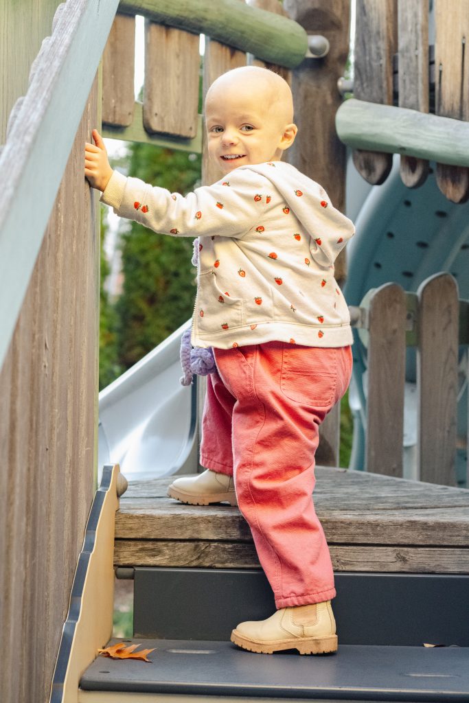 A child climbs a slide