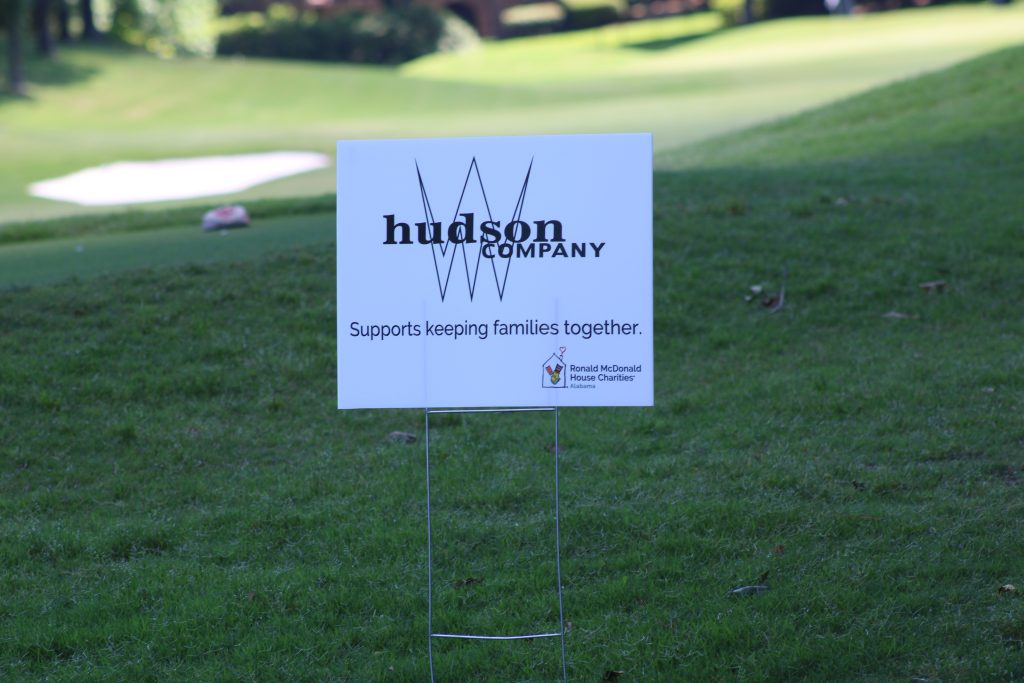 A yard sign highlighting an event sponsor