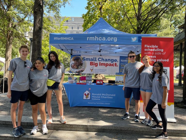 A group of students at an event tent