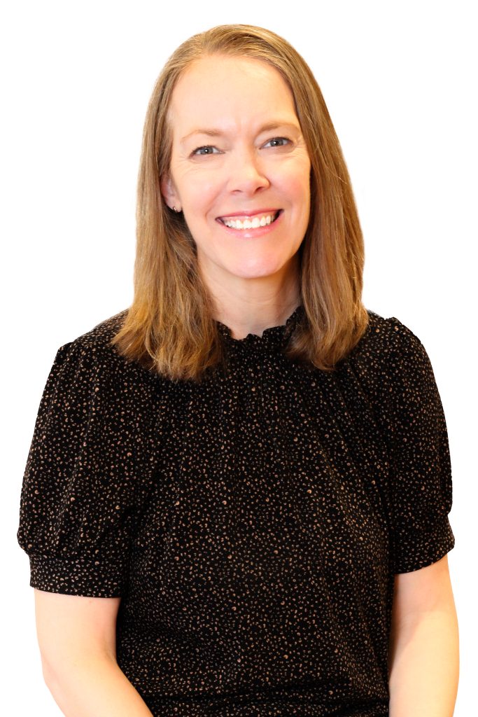 A woman poses for a photo