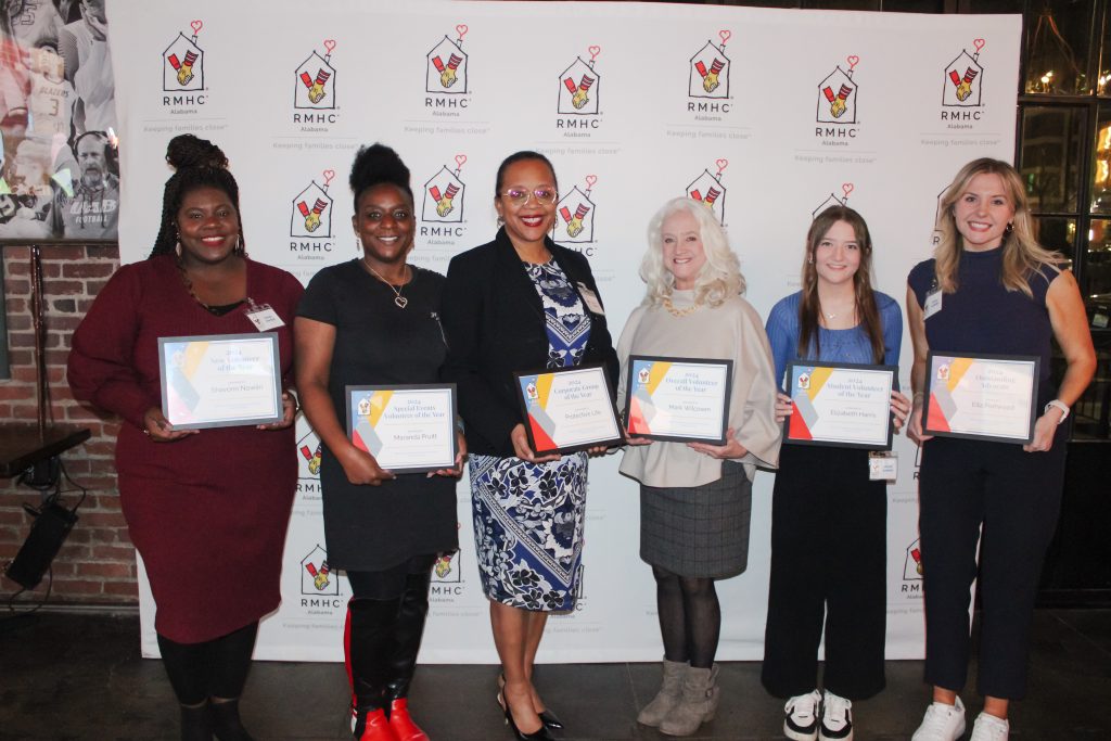 Six volunteers pose for a photo