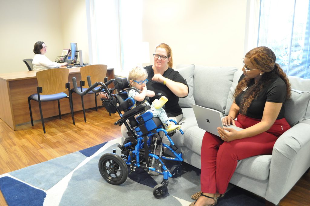 A mom speaks with an RMHC of Alabama staff member