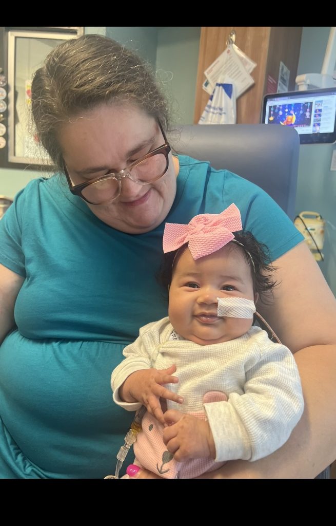 Shayla with her Grandmother Carolyn holding her in her arms